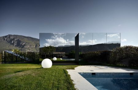 Mirror houses covered with mirrors creates an illusion that the property is almost invisible